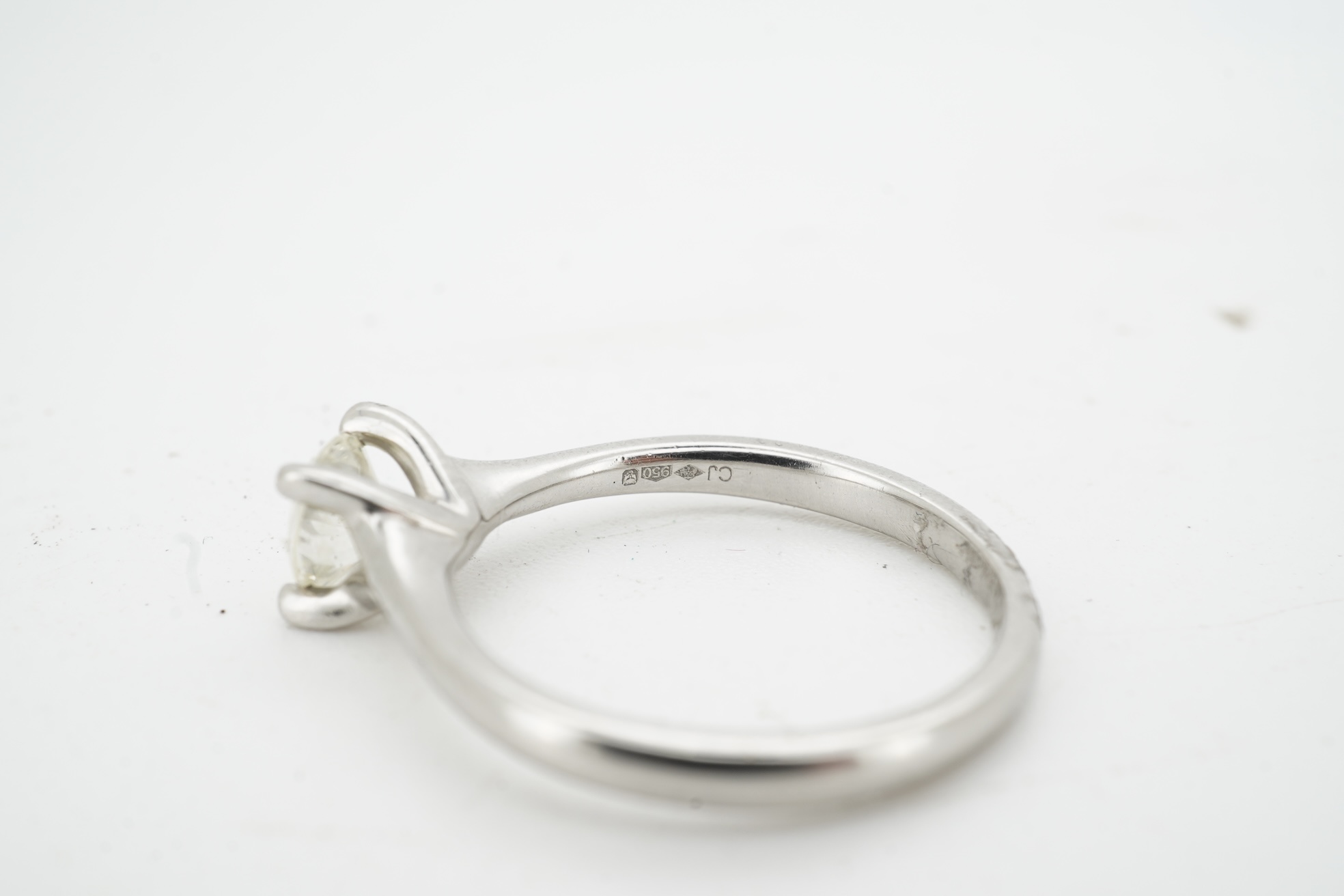 A diamond ring, claw-set with a brilliant-cut diamond weighing approximately 0.50 carats, mounted in platinum, size K, British hallmarks, gross weight approximately 4 grams